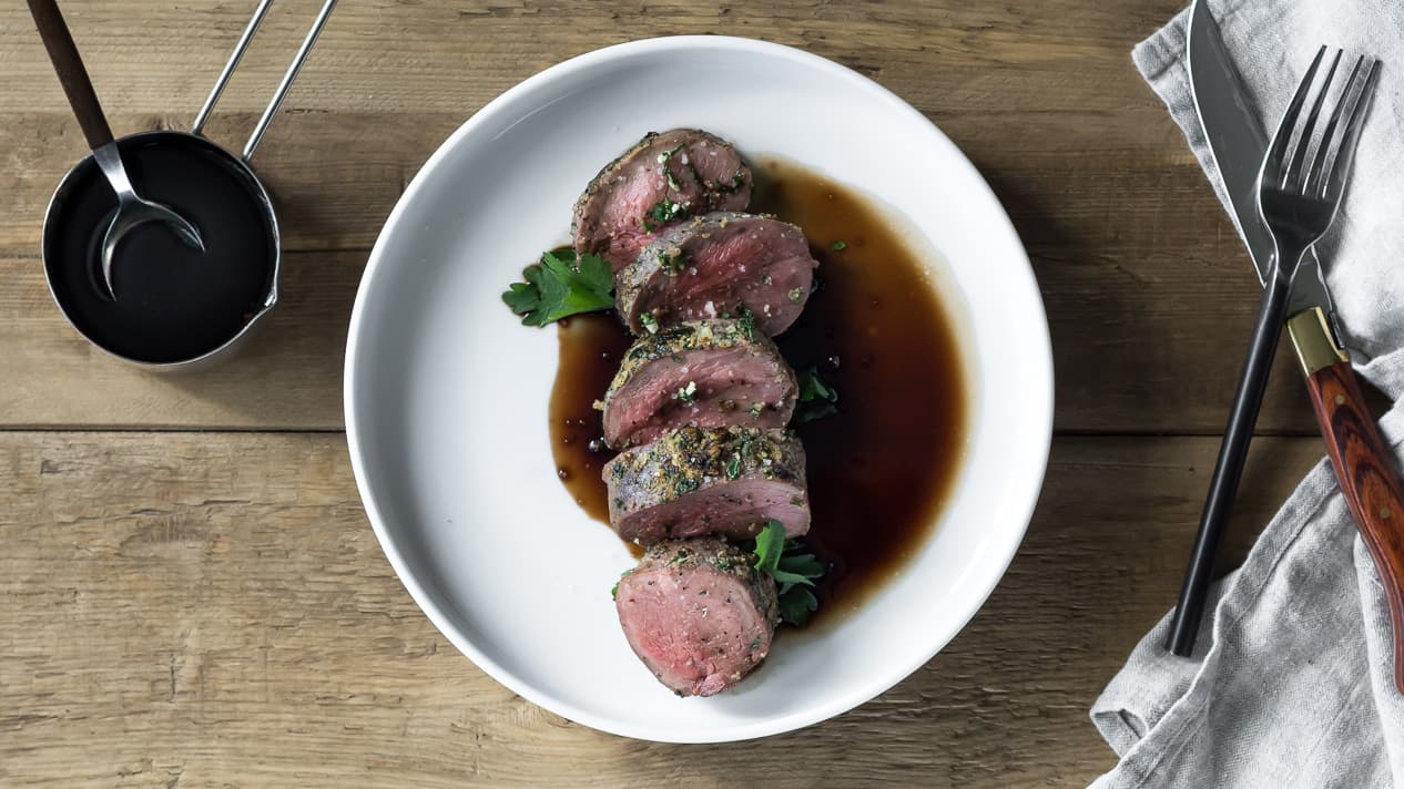 Roasted venison loin with chestnut purée, chard and a dark sauce